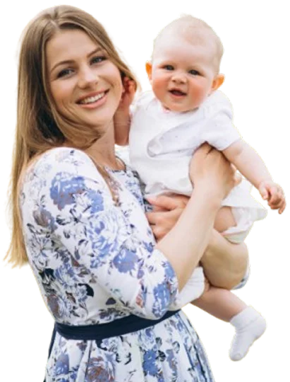 Smiling caregiver holding a baby.